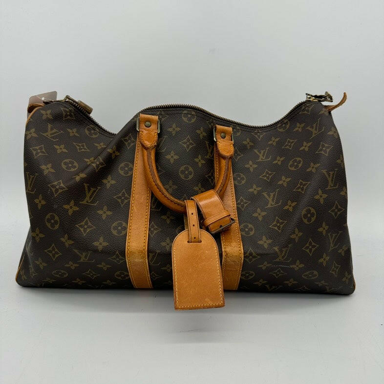 Louis Vuitton Medium Brown Monogram Canvas Travel Bag With Leather Handles.