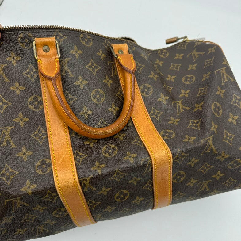 Louis Vuitton Medium Brown Monogram Canvas Travel Bag With Leather Handles.