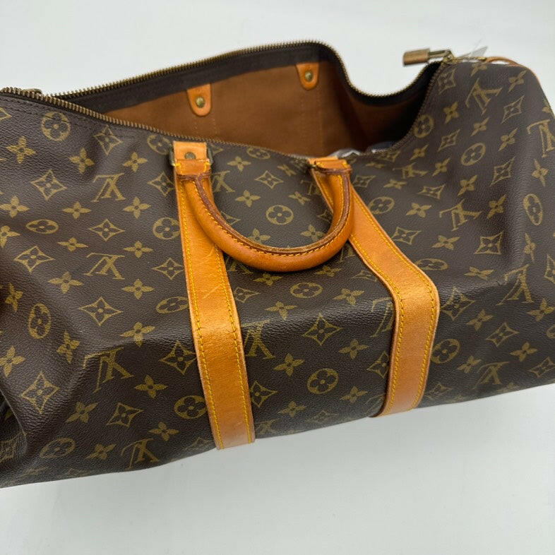 Louis Vuitton Medium Brown Monogram Canvas Travel Bag With Leather Handles.