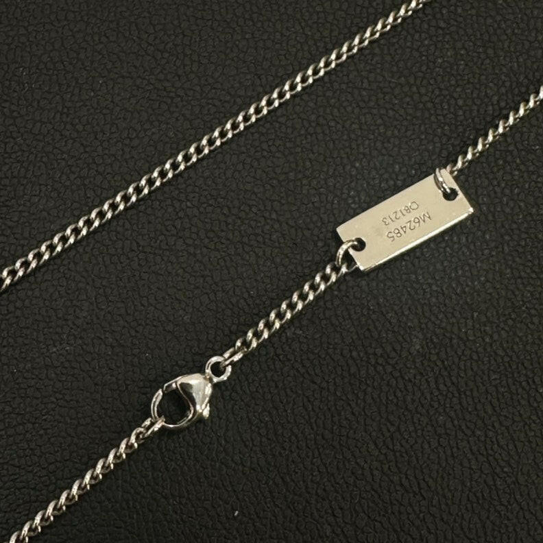 Louis Vuitton Silver Pendant Necklace with Monogram Charm and Ring Charm.