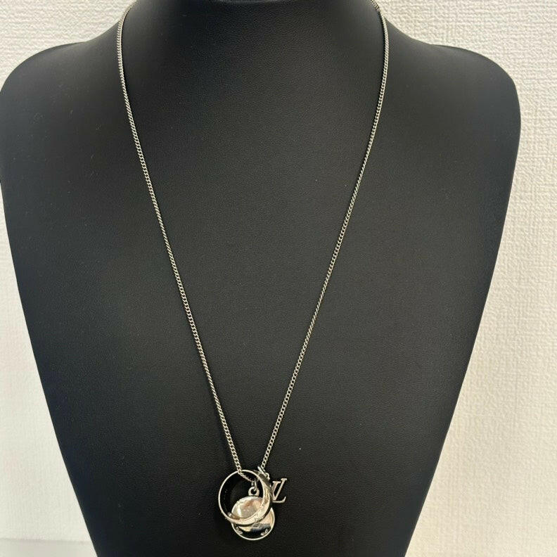 Louis Vuitton Silver Pendant Necklace with Monogram Charm and Ring Charm.