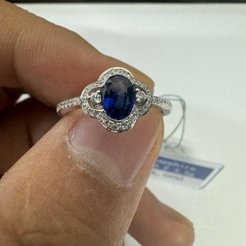 Blue Sapphire Ring with Diamond Accents in 18K White Gold, 0.55 Carat, 3.5 Grams, Size 7.