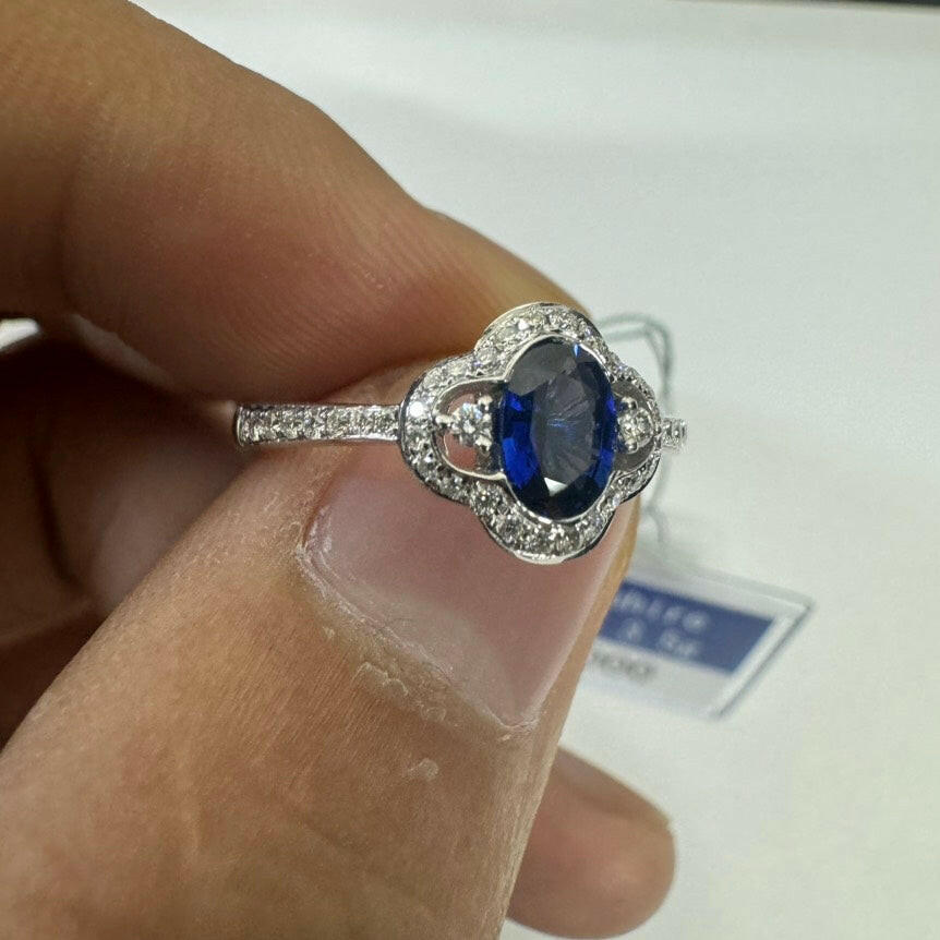 Blue Sapphire Ring with Diamond Accents in 18K White Gold, 0.55 Carat, 3.5 Grams, Size 7.