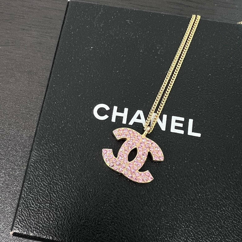 Chanel Gold Chain Necklace with Pink Rhinestone Logo Pendant.