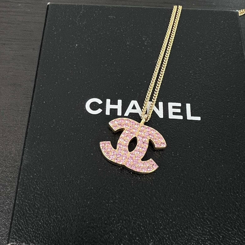 Chanel Gold Chain Necklace with Pink Rhinestone Logo Pendant.