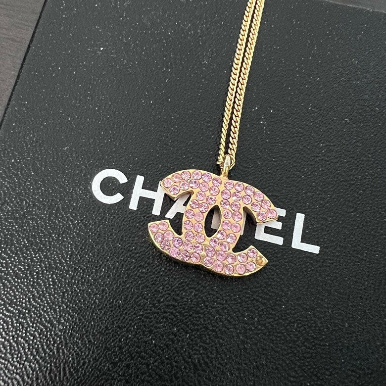 Chanel Gold Chain Necklace with Pink Rhinestone Logo Pendant.